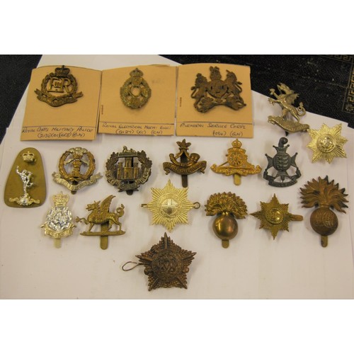 279 - Large collection of loose and mounted on card military badges, with two small boxes of military butt... 