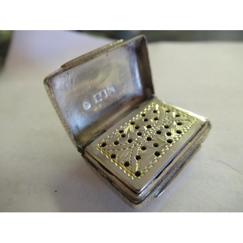 691 - Miniature white metal folding photograph frame, Victorian silver vinaigrette and a Swiss watch movem... 