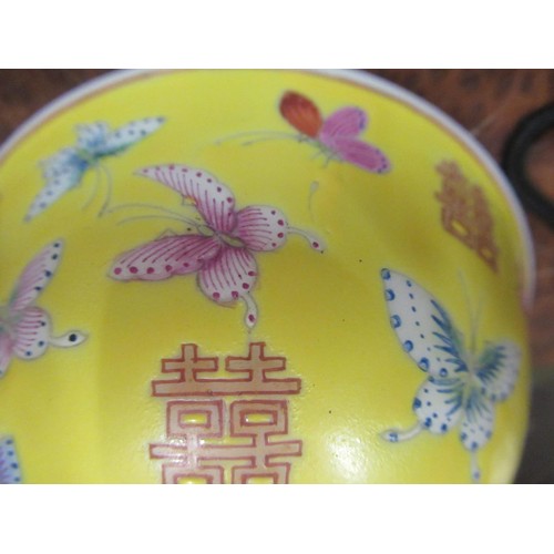 487 - Set of four Chinese rice bowls decorated with butterflies and moths on a yellow ground , signed with... 