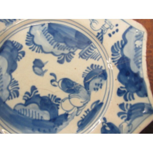 479 - Two 19th Century Continental Delft ware plates, 11.75ins diameter (at fault)