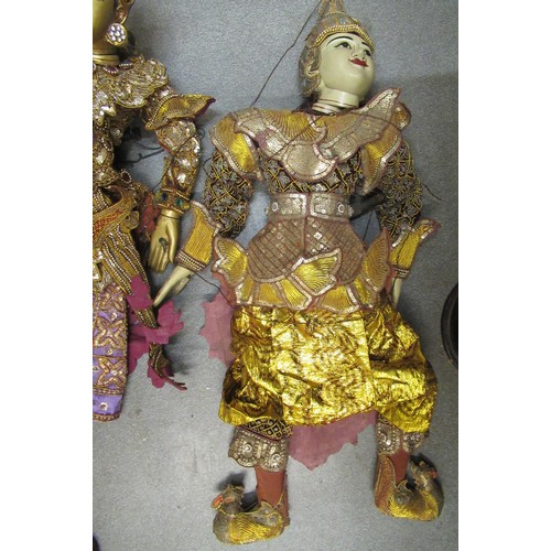 256 - Collection of seven various large Burmese carved wooden puppets with sequin decorated costumes, each... 