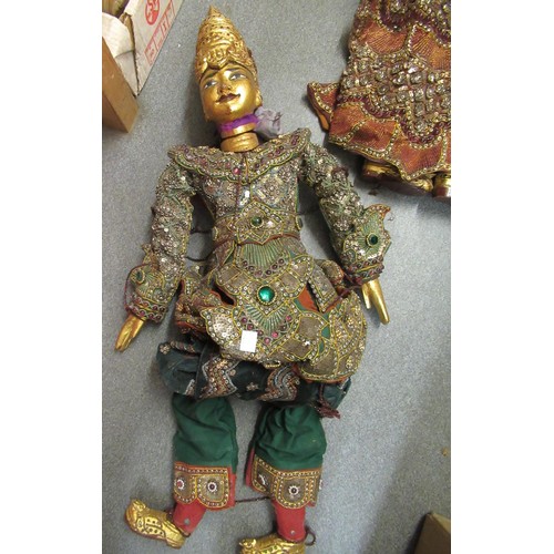 256 - Collection of seven various large Burmese carved wooden puppets with sequin decorated costumes, each... 