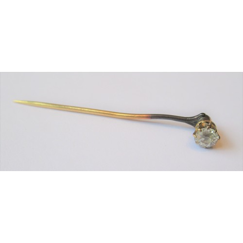 702 - Yellow metal solitaire diamond stick pin of approximately 0.2ct