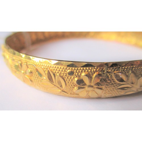 700 - Indian floral embossed yellow metal bangle, 15g