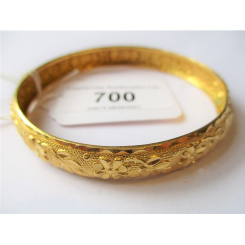 700 - Indian floral embossed yellow metal bangle, 15g