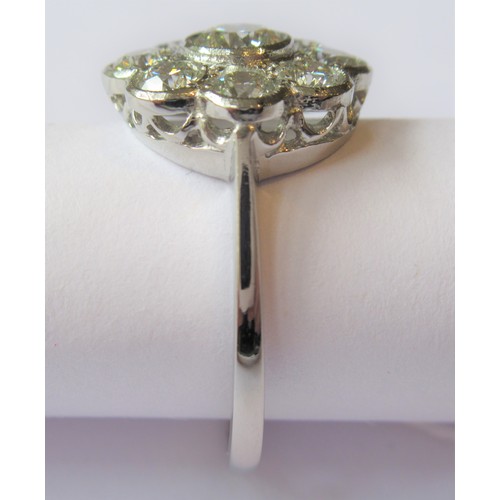 709 - Platinum diamond flowerhead cluster ring, the nine diamonds approximately 1.50ct total