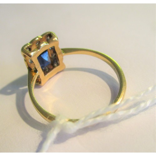 717 - 18ct Yellow gold rectangular sapphire and diamond cluster ring