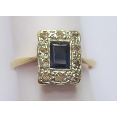 717 - 18ct Yellow gold rectangular sapphire and diamond cluster ring