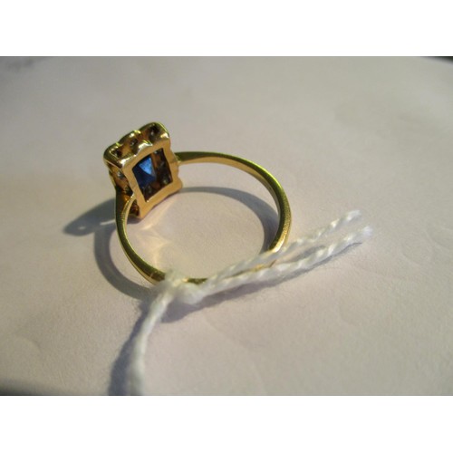 717 - 18ct Yellow gold rectangular sapphire and diamond cluster ring