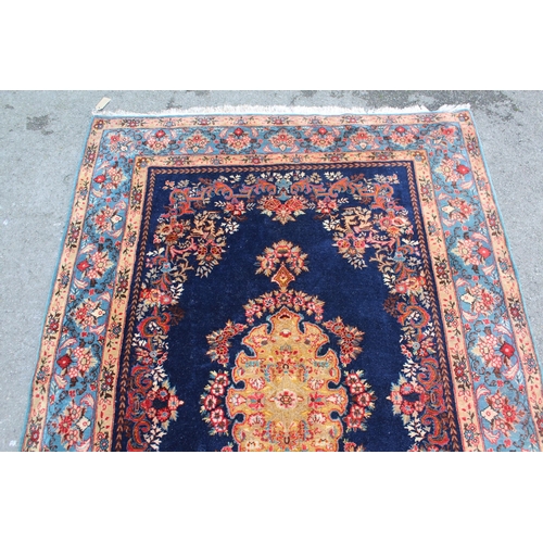 13 - 20th Century Kirman part silk rug with a lobed floral medallion and stylised floral design on a midn... 