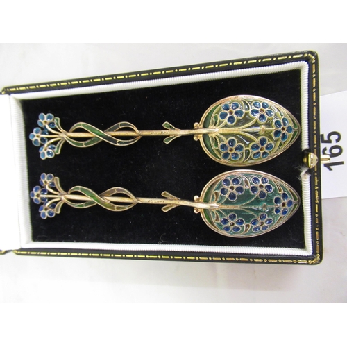 165 - Cased pair of Continental silver gilt and enamel coffee spoons of floral design