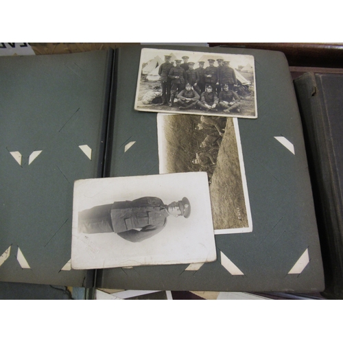 224 - Two albums containing a collection of early 20th Century postcards, together with a quantity of loos... 