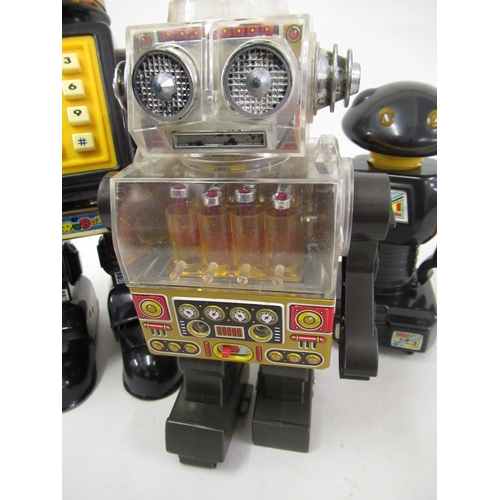 275 - Japanese tin plate and plastic robot together with two other plastic robots