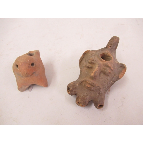 294 - Pre-Columbian clay bird whistle, 2.5ins wide x 2.45ins high, together with a similar mask head whist... 