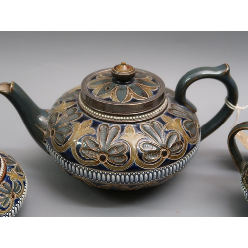 549 - Late 19th Century Doulton Lambeth stoneware three piece tea service with typical stylised floral dec... 