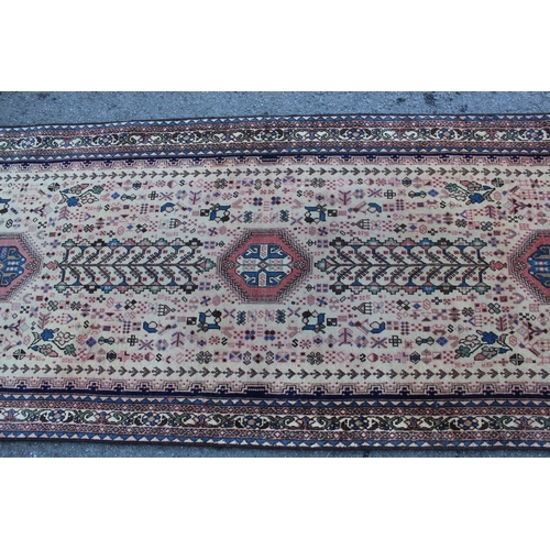 6 - Abadeh runner with a medallion and all-over design on a blue ground with borders, 3.1m x 95cms appro... 