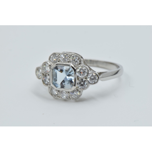 878 - Platinum ring set aquamarine and brilliant cut diamonds