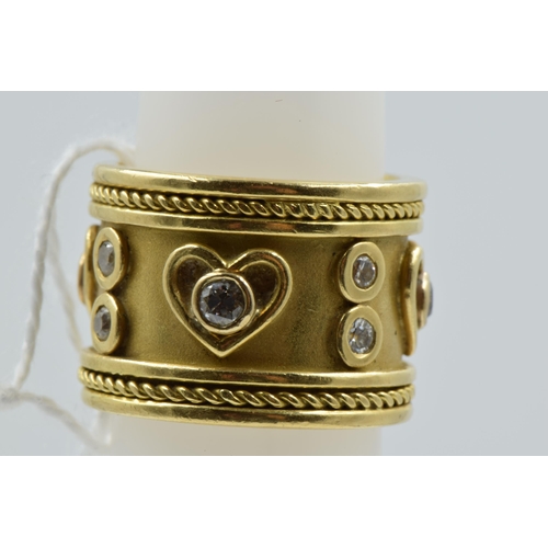 908 - Heavy 18ct gold wide band ring set with diamonds in heart motifs, 17.5g