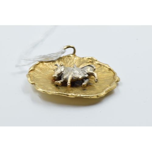 911 - 9ct Two colour gold Taurus the bull zodiac pendant, 16g