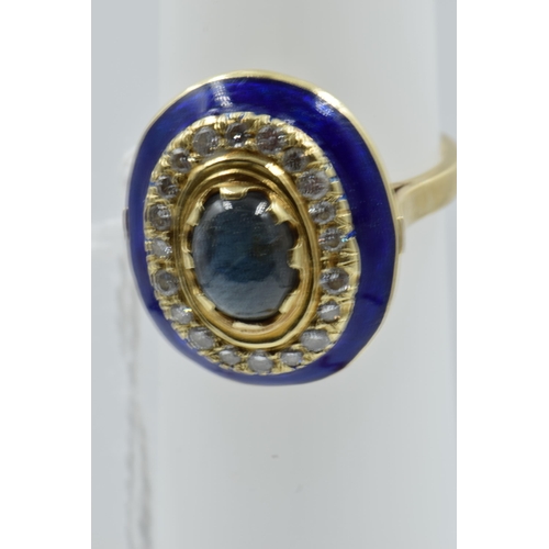 917 - 18ct Yellow gold dress ring set central cabochon sapphire surrounded by band of diamonds and blue en... 