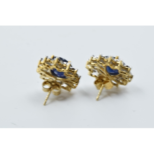 923 - Pair of 9ct yellow gold oval sapphire and diamond cluster stud earrings