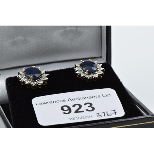 923 - Pair of 9ct yellow gold oval sapphire and diamond cluster stud earrings