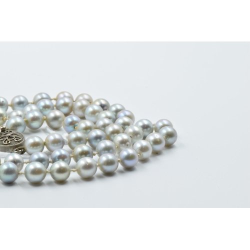 928 - Single row uniform grey cultured pearl necklace with silver clasp, 23.5ins long