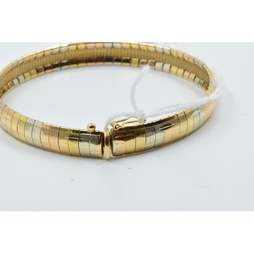 948 - 18ct Three colour gold bracelet of articulated design, 20g