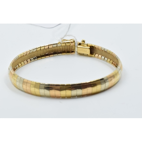 948 - 18ct Three colour gold bracelet of articulated design, 20g