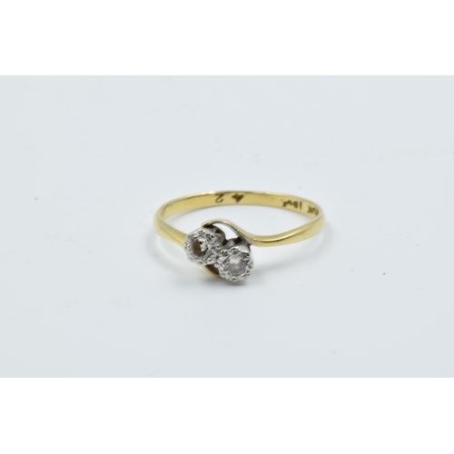 965 - Two 18ct yellow gold two stone diamond crossover rings, together with a diamond solitaire ring