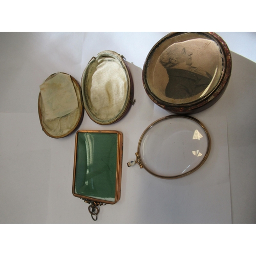 977 - Pair of miniature brass frames with bow surmounts, 3.25ins high, a similar oval frame and a quantity... 