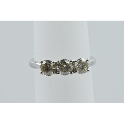 979 - 18ct White gold brilliant cut diamond trilogy ring, the diamonds approximately 1.02ct, together with... 