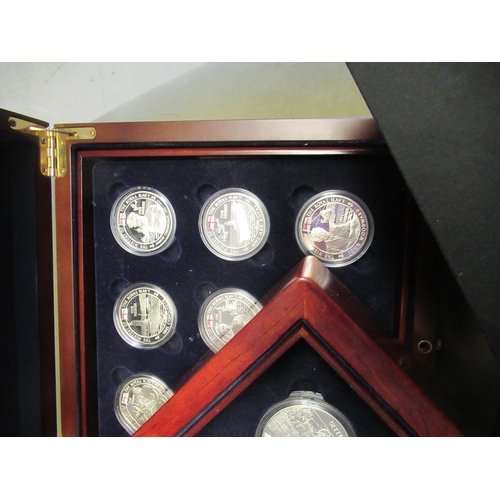 980 - Two mahogany cased sets of eighteen silver proof five pound coins, of railway related subjects, anot... 