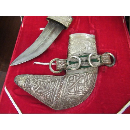 255 - Middle Eastern white metal presentation dagger in a fitted case, mid 20th Century