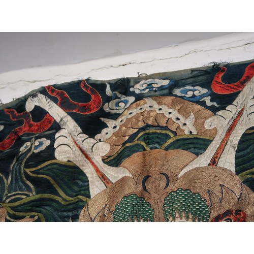 50 - Late 19th / early 20th Century Chinese silk and gold threadwork wall hanging depicting a dragon on a... 