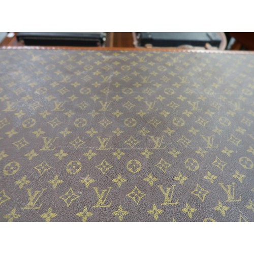 167 - Vintage Louis Vuitton suitcase with brass catches and corner mounts, the hinged lid enclosing a void... 