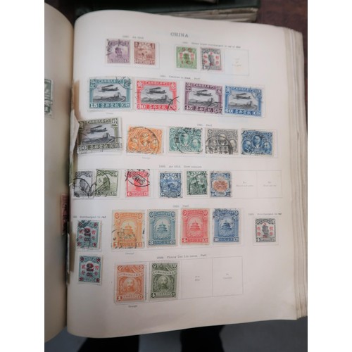 219 - Two large green Ideal postage stamp albums containing an extensive collection of World stamps, toget... 