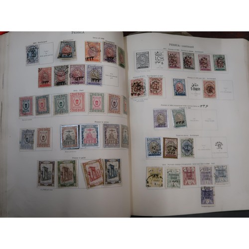 219 - Two large green Ideal postage stamp albums containing an extensive collection of World stamps, toget... 