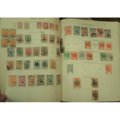 219 - Two large green Ideal postage stamp albums containing an extensive collection of World stamps, toget... 