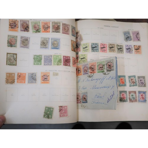 219 - Two large green Ideal postage stamp albums containing an extensive collection of World stamps, toget... 