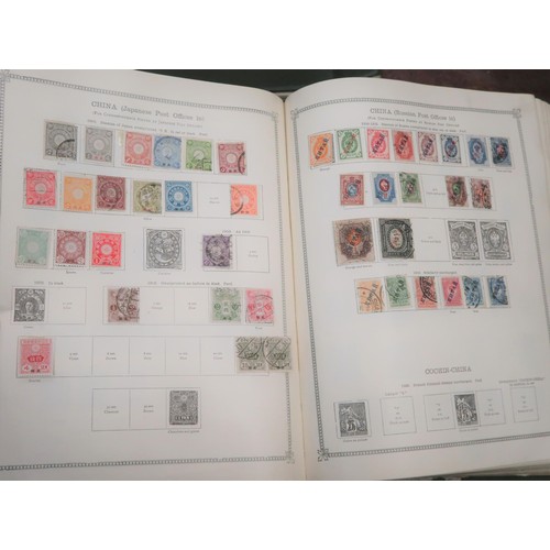 219 - Two large green Ideal postage stamp albums containing an extensive collection of World stamps, toget... 