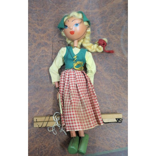 220A - Group of five various boxed Pelham puppets to include an early type SS Dutch girl