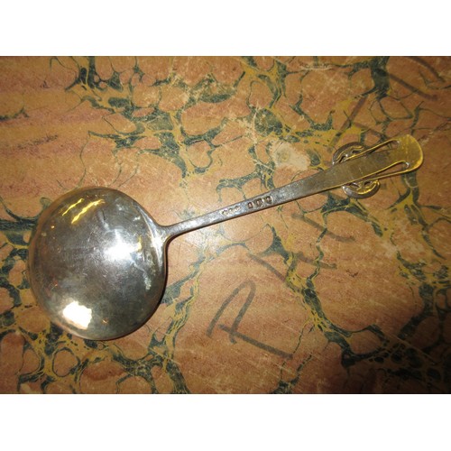 783 - Liberty & Co. early 20th Century beaten silver spoon with stylised handle, Birmingham 1907