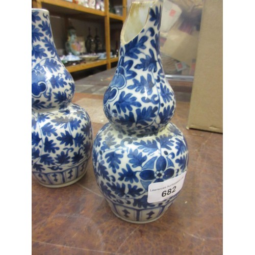 682 - Pair of Chinese blue and white gourd shaped vases (one at fault), 7.5ins high