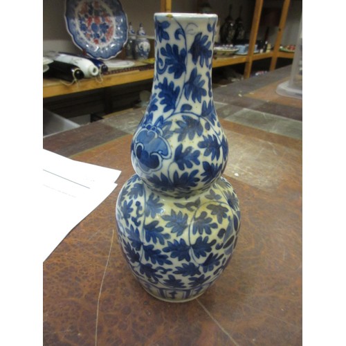 682 - Pair of Chinese blue and white gourd shaped vases (one at fault), 7.5ins high