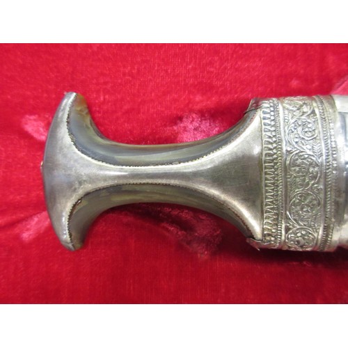 255 - Middle Eastern white metal presentation dagger in a fitted case, mid 20th Century