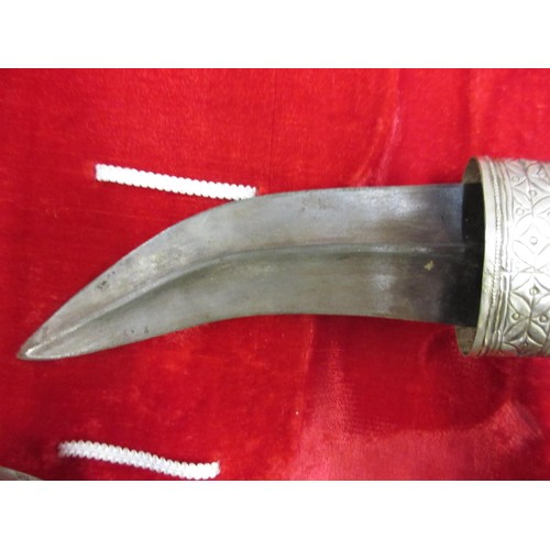 255 - Middle Eastern white metal presentation dagger in a fitted case, mid 20th Century