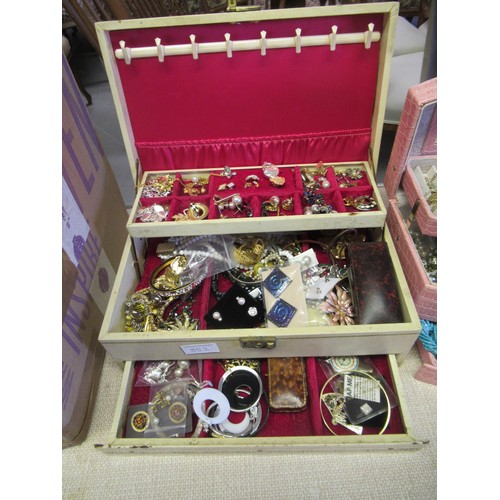 852 - Large quantity of various costume jewellery housed in various jewellery boxes