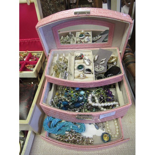 852 - Large quantity of various costume jewellery housed in various jewellery boxes