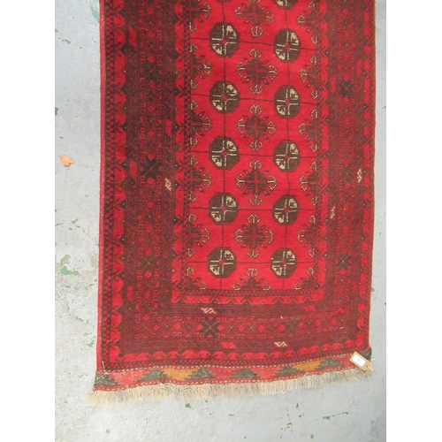 26 - Antique Kurdish rug, having all over stylised floral design, midnight ground with multiple borders, ... 